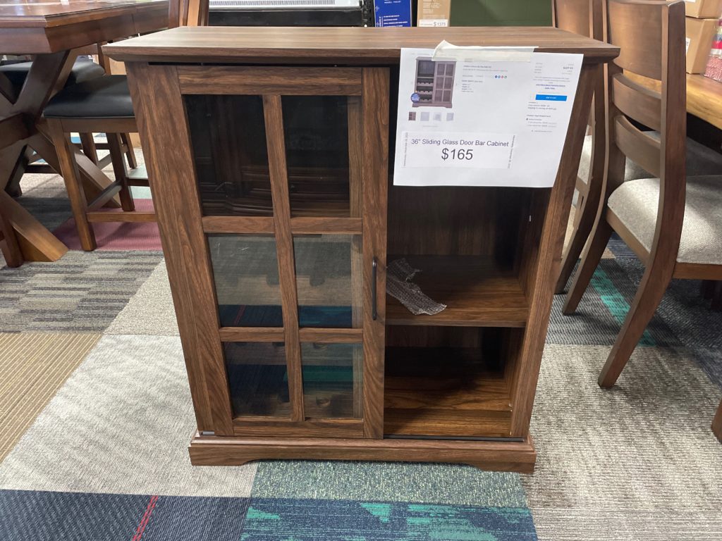 Dark wood 3-shelf cabinet with glass door on half of the front
