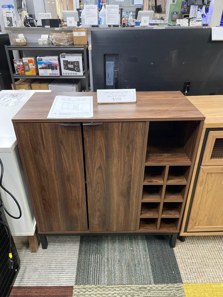 Dark wood cabinet with 2 doors and cubbies