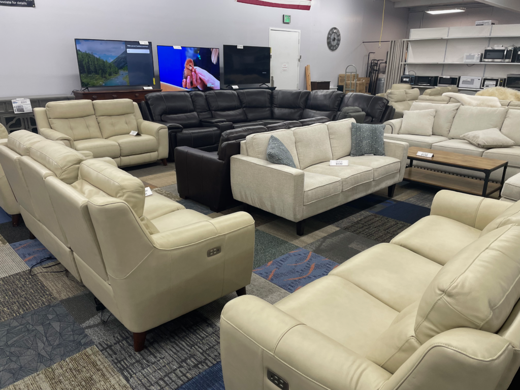 Beige and black sectionals and love seats