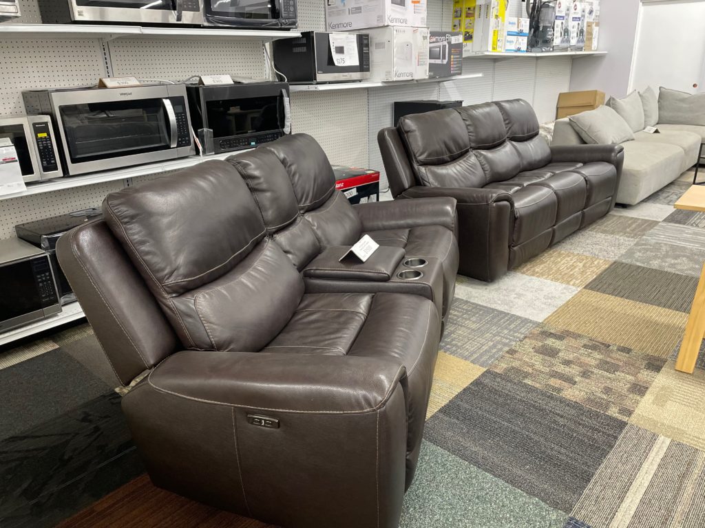 Dark brown leather love seat with center console, couch