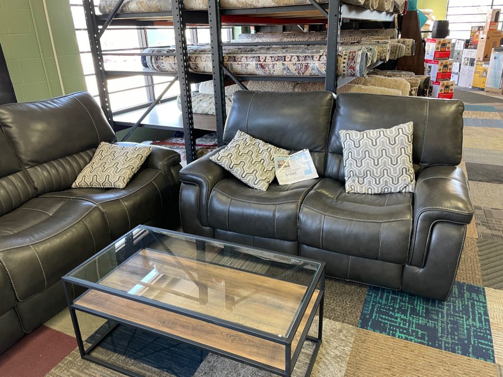 Dark gray leather love seat