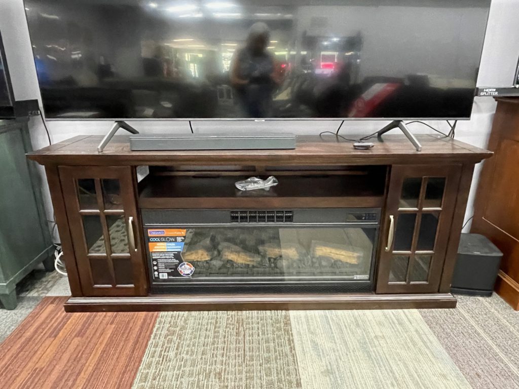 TV console the shelf and 2 glass doors and fireplace inset