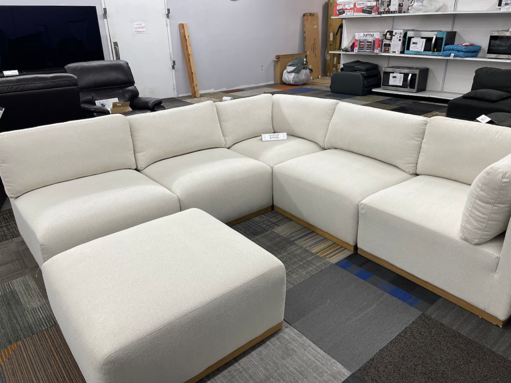 Off white fabric sectional with ottoman