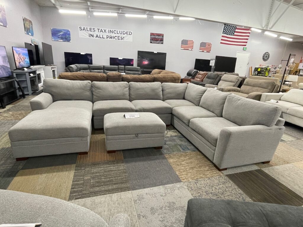 Light brown fabric sectional and ottoman