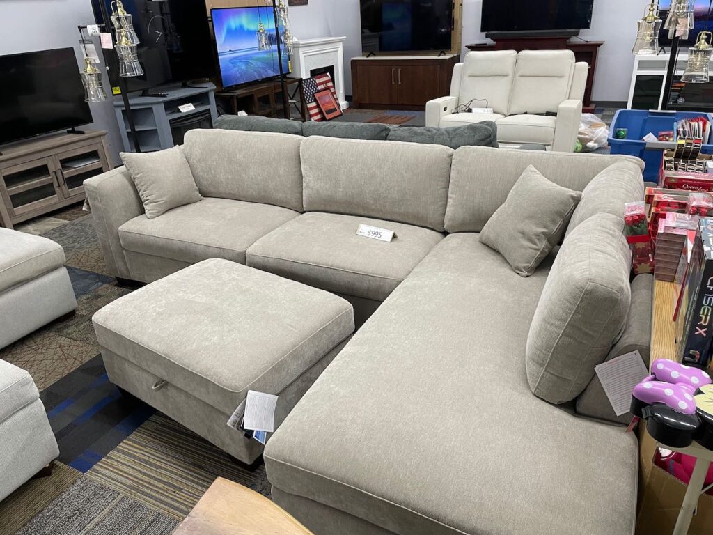 Beige fabric couch with chaise and ottoman