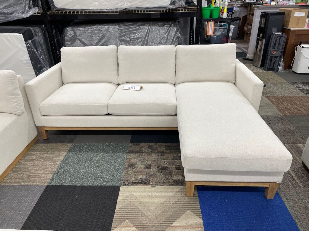 Light beige fabric couch with chaise