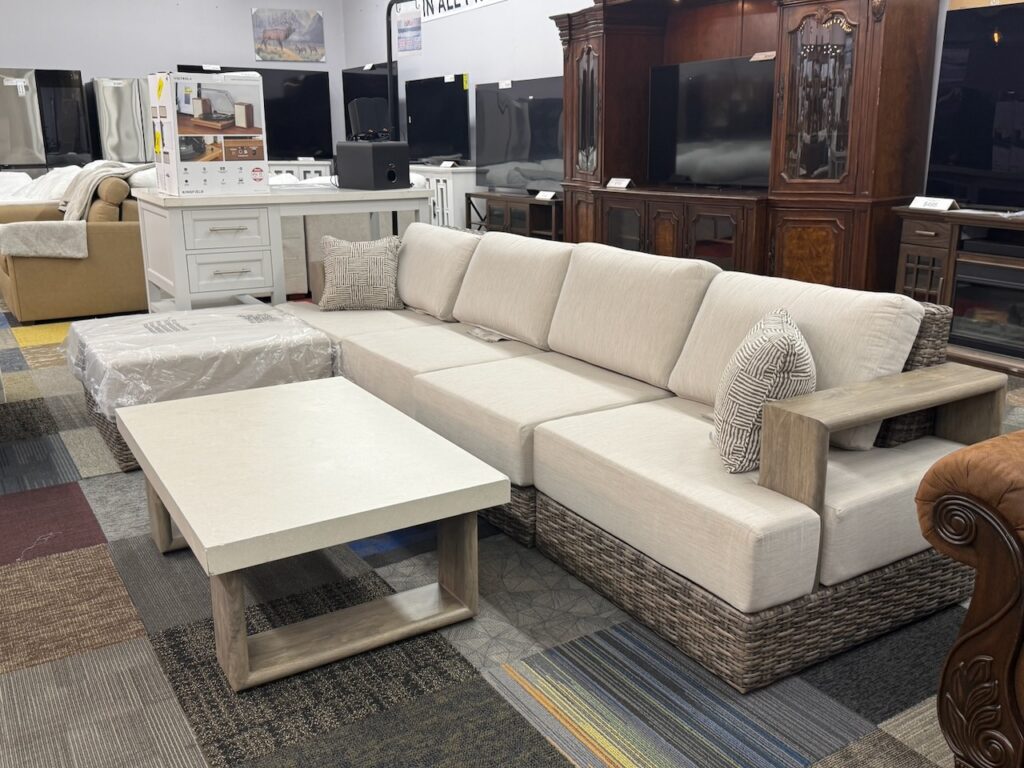 White fabric sectional with wicker bottom