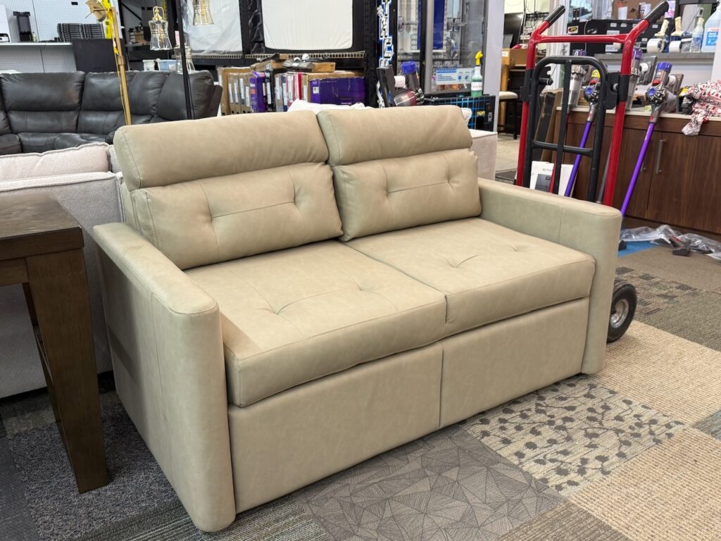 Beige leather love seat