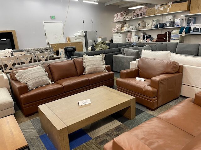 Brown leather couch and love seat